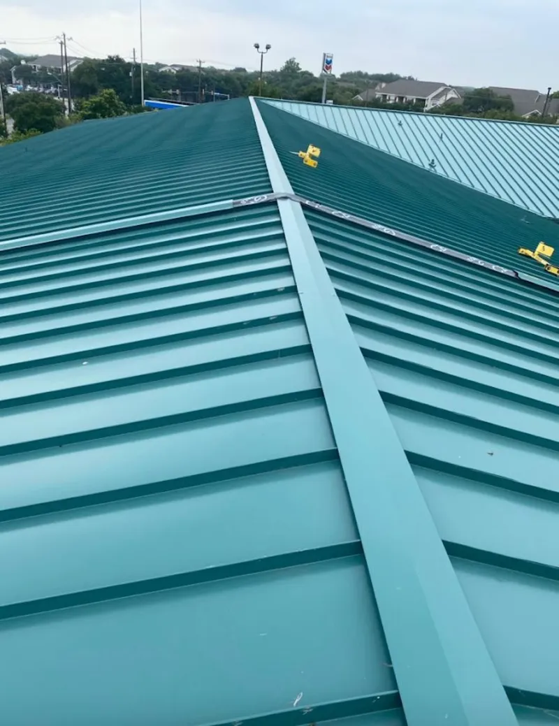 Green commercial metal roof ridge and valley for Metal Roof Repair in Fort Atkinson